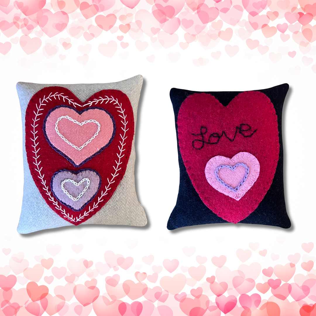 Photo of 2 pincushions with wool appliqué hearts and perle cotton embellishments